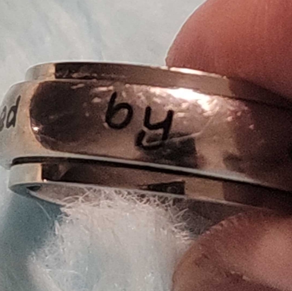 Ring, silver tone, reads "protected by an angel" in black, size 9 - Picture 2 of 7